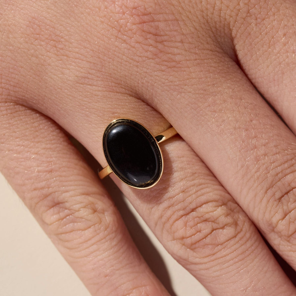 Black Oval Stone Ring in Gold